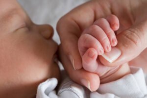 newborn-baby-holding-moms-hand