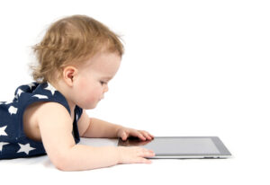 Baby-girl-playing-with-tablet