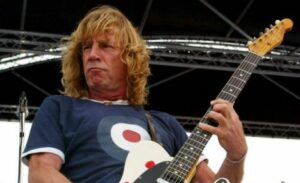 Status Quo performing  songs from their new album 'Heavy Traffic' aboard HMS Ark Royal in Portsmouth Docks.
